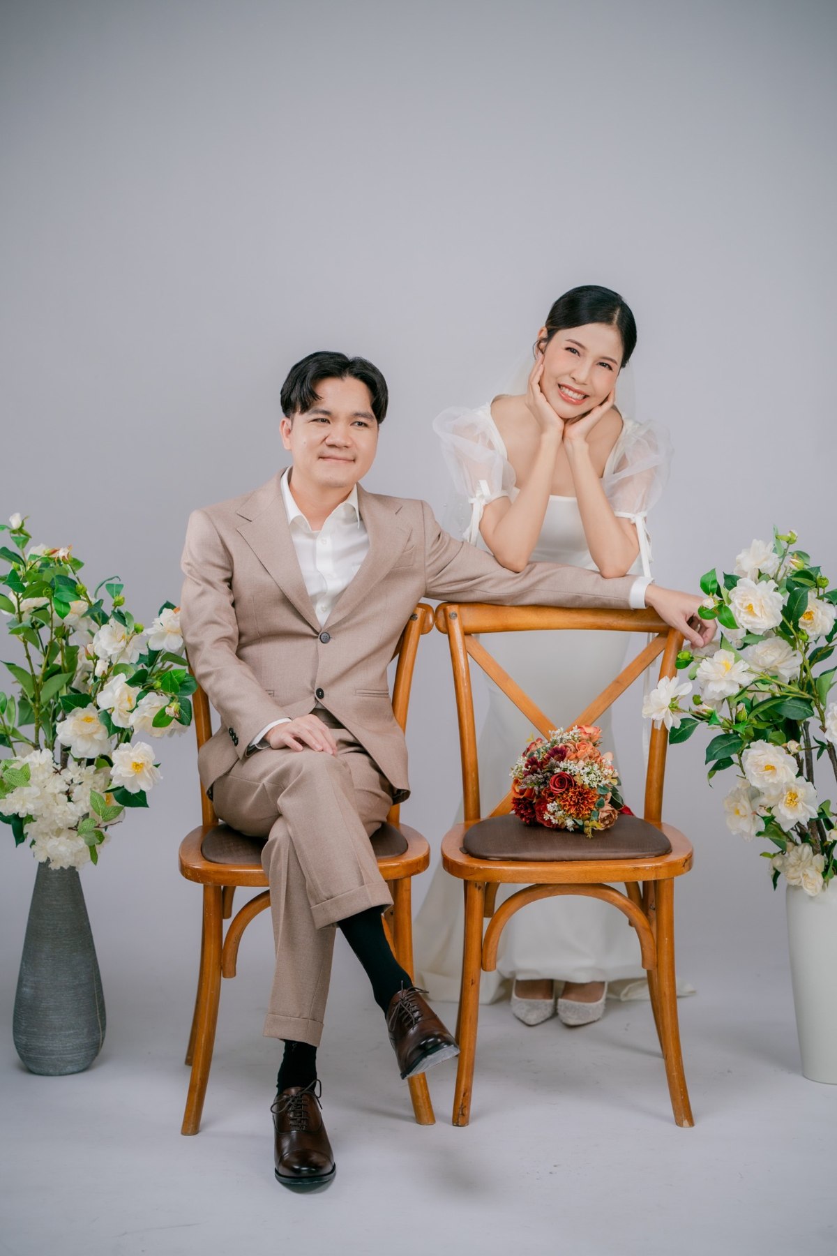 Amm and Hrung seated with flowers